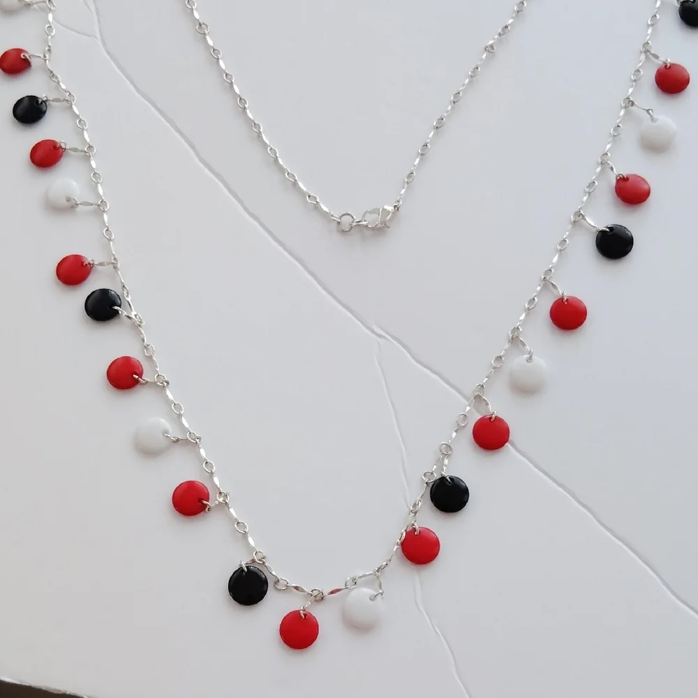 Elegant Silver Necklace with Red, Black, and White Accents - Picture 2 of 2
